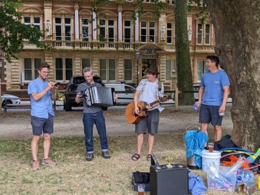 A photo of Tom, Jack, Steve and Rich playing musical instruments at the annual CareScribe summer sports day.