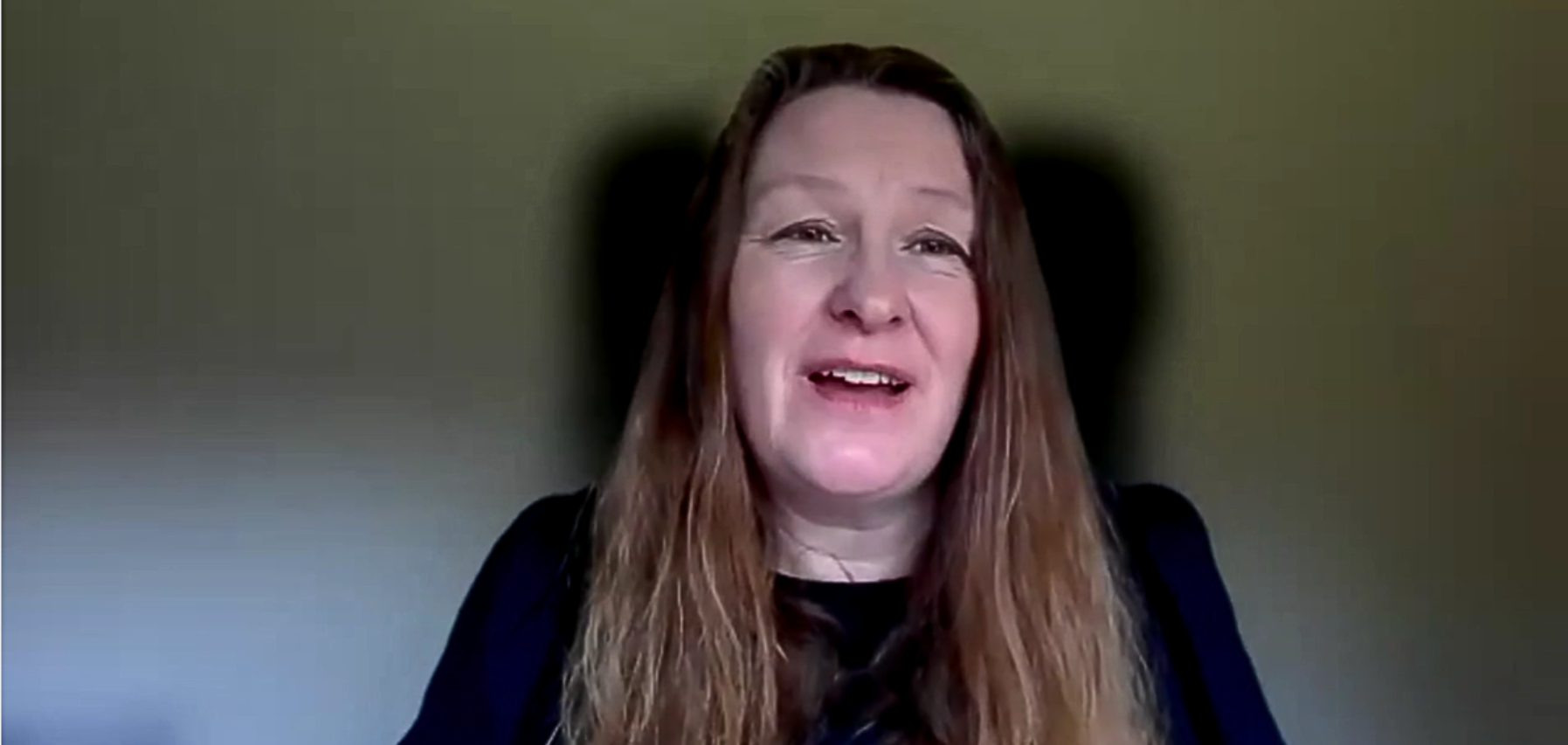 Screenshot captured during Helen's live webinar. Helen is wearing black and has long brown hair. She is talking directly at the camera.